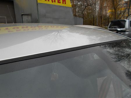 Крыша Toyota Corolla после ремонта и покраски