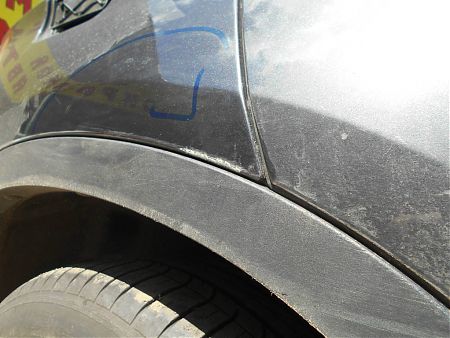 Поврежденный участок на заднем правом крыле BMW X6